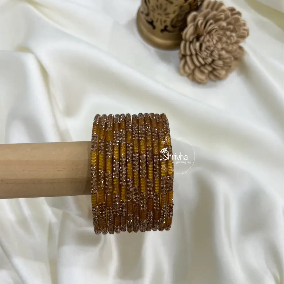 Elegant stone-embellished bangles with glittery finish for women