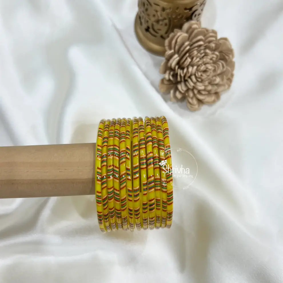 Majestic patterned royal bangles paired with silk saree outfit