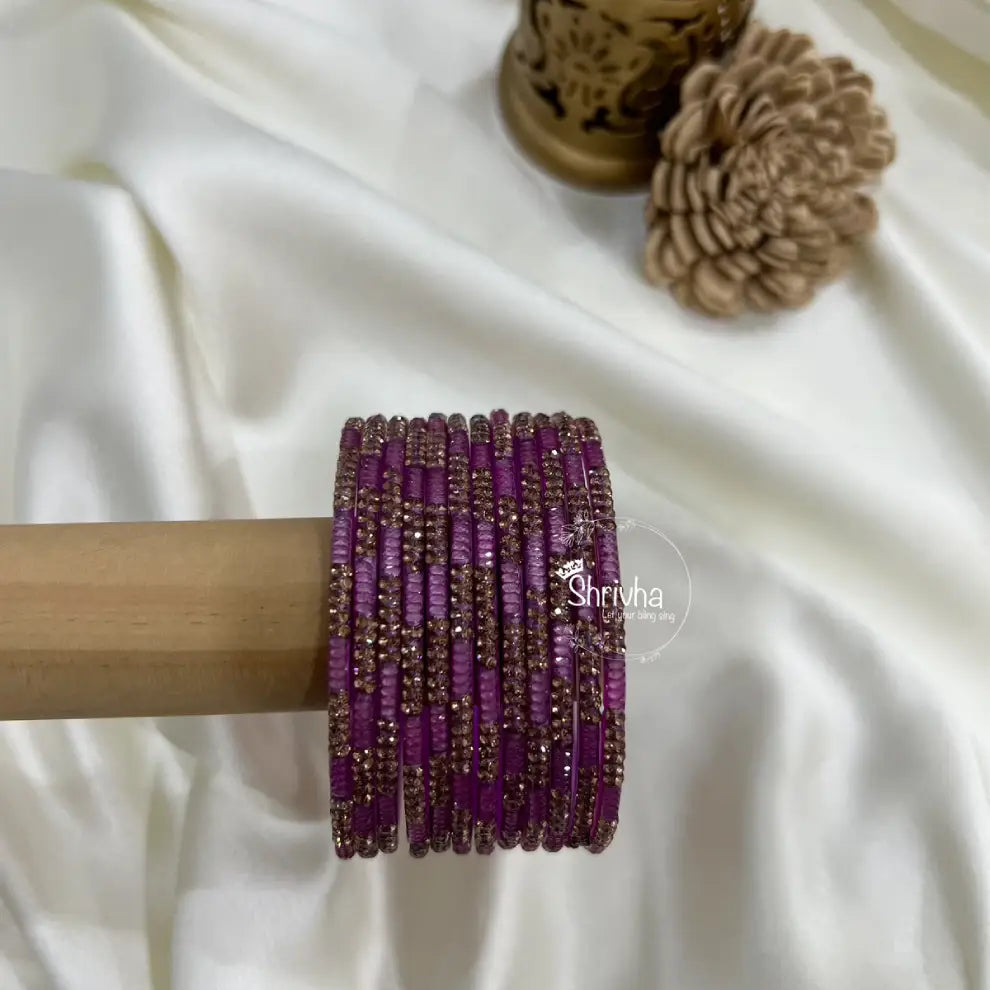 Stone-studded glass bangles with regal traditional design