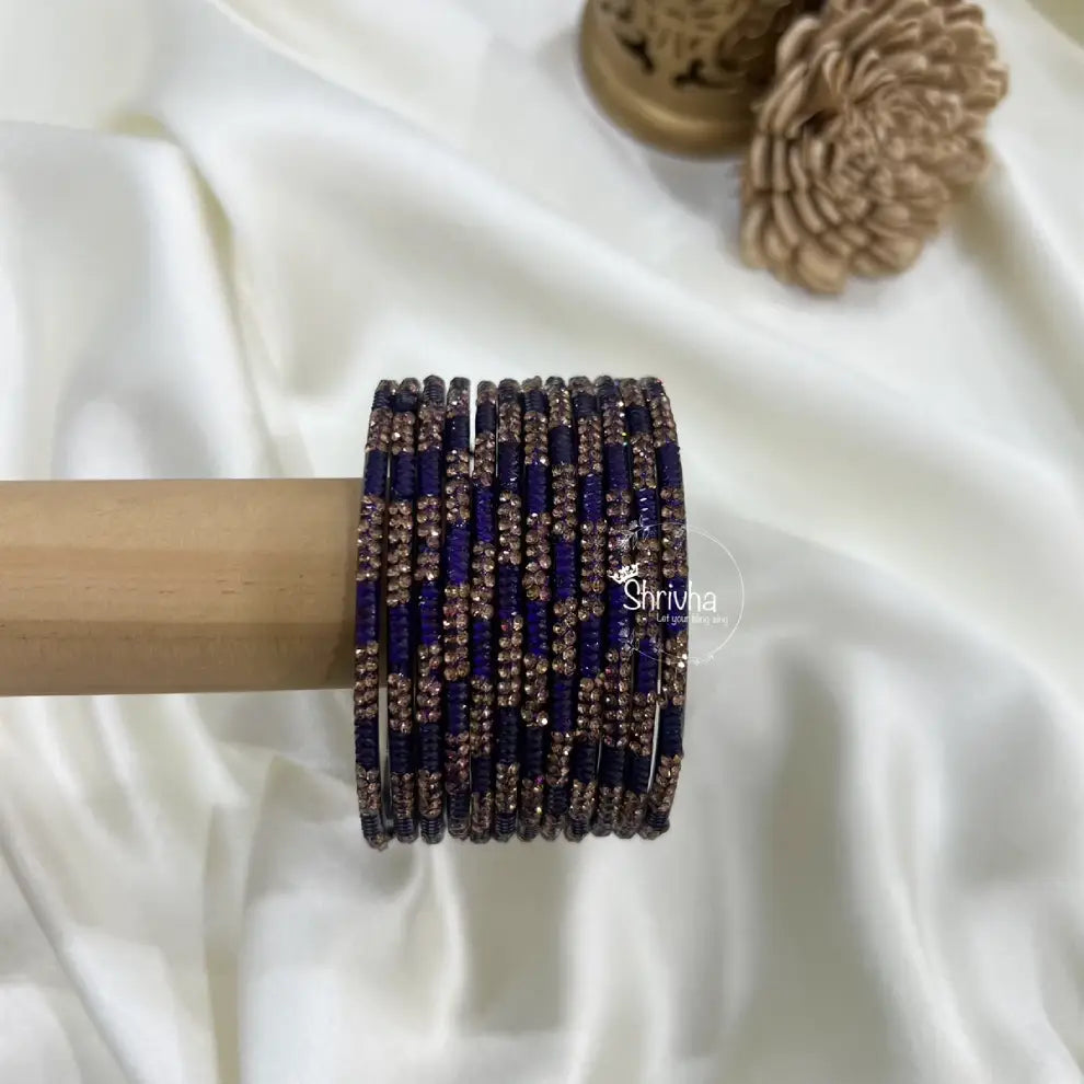 Traditional glass bangles with luxurious royal patterns and stones