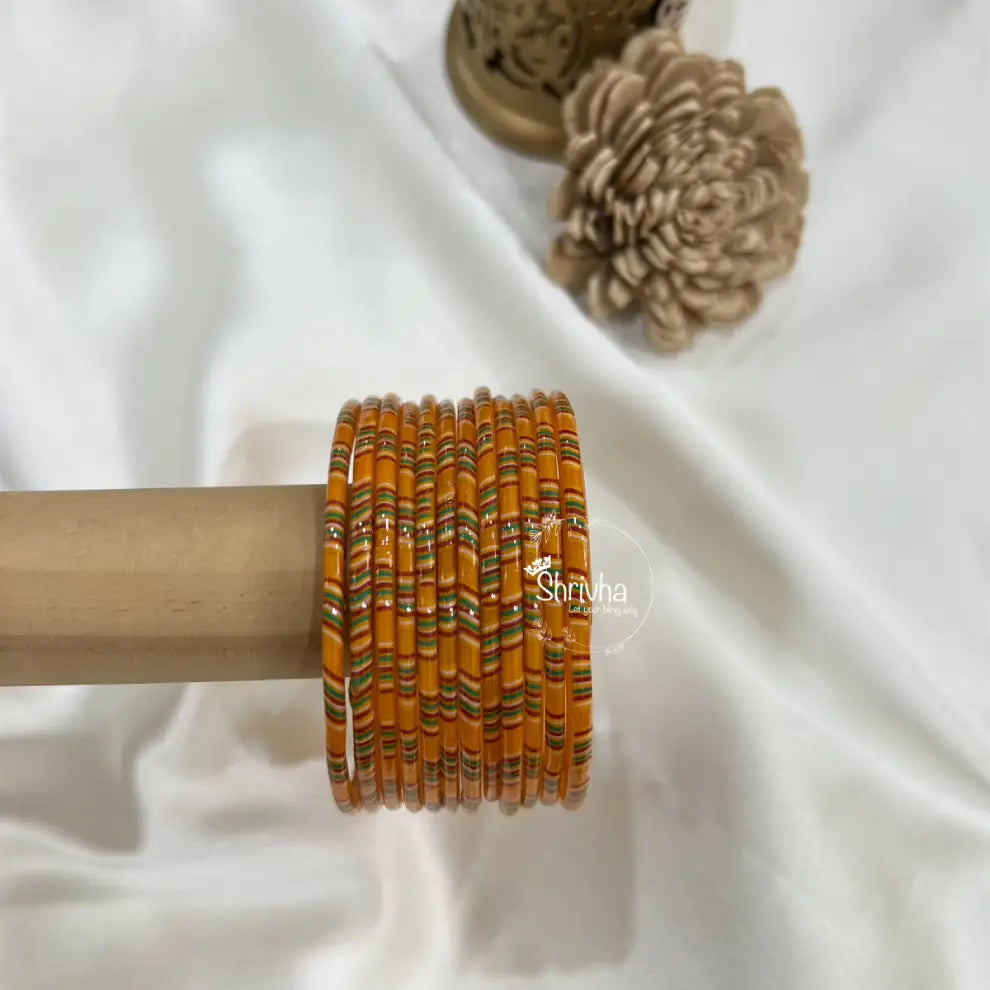 Transparent glass bangles featuring glitter and royal craftsmanship