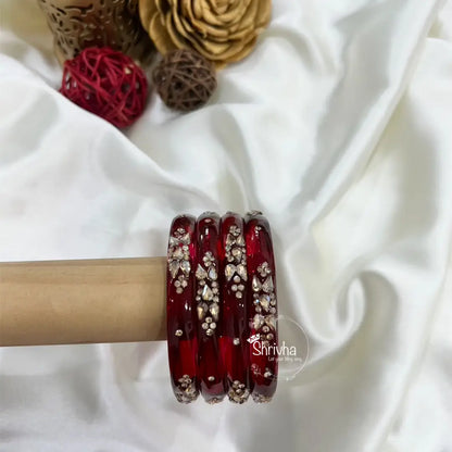 Beaded blossom glass bangles shining under festive lights