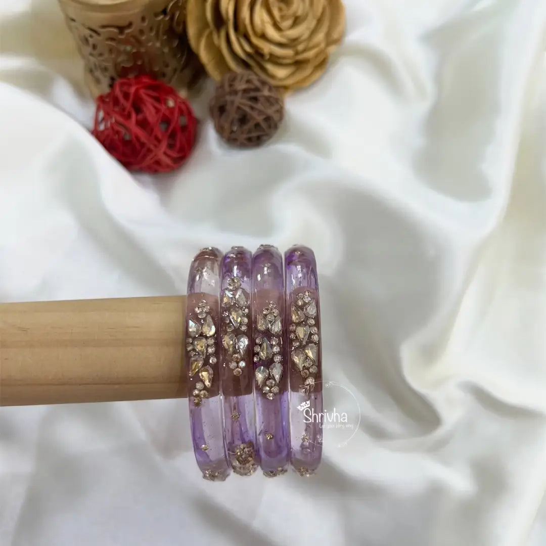 Traditional Indian glass bangles with floral bead detailing