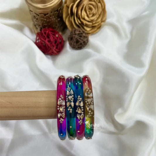 Transparent glass bangles with beaded blossom pattern by Shrivha